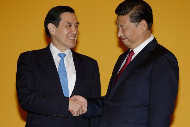 Chinese President Xi Jinping, right, and Taiwanese President Ma Ying-jeou, left, shake hands at the Shangri-la Hotel on Saturday, Nov. 7, 2015, in Singapore. The two leaders shook hands at the start of a historic meeting marking the first top level contact between the formerly bitter Cold War goes since they split amid civil war 66 years ago. (AP Photo/Wong Maye-E)